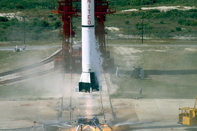 Mercury-Redstone 3 lifting off with Freedom 7 on May 5, 1961, its alcohol and liquid oxygen engine producing a pale exhaust plume.