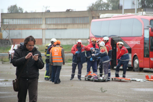 Emergency responders assist at a roadside accident scene in Eleusis, Greece.