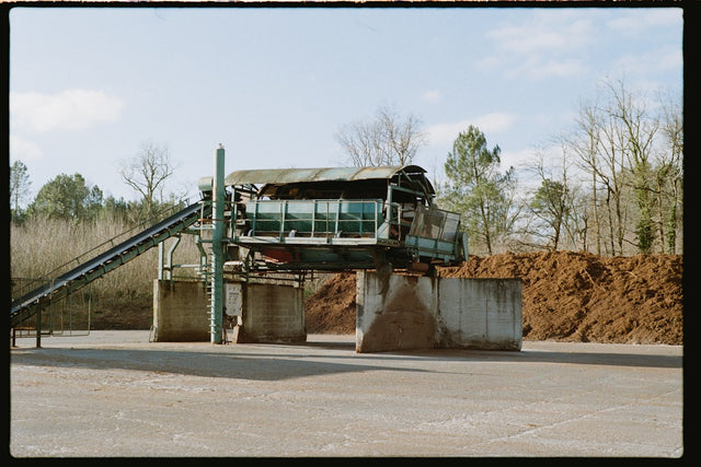 Industrial mining machinery and conveyor belts at phosphate processing facility