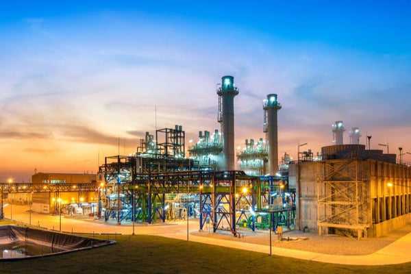 Industrial power plant and boiler facility at sunset