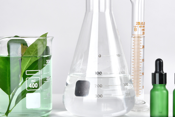 Natural cosmetic formulation with glass flasks and botanical ingredients