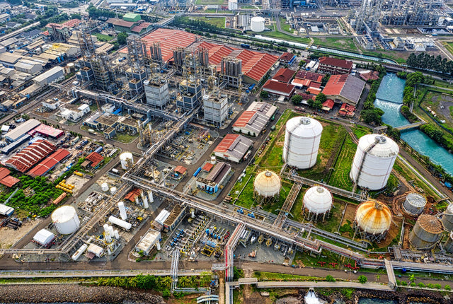 A detailed aerial view of an industrial facility in Banten, Indonesia, showcasing large tanks and architectural structures.