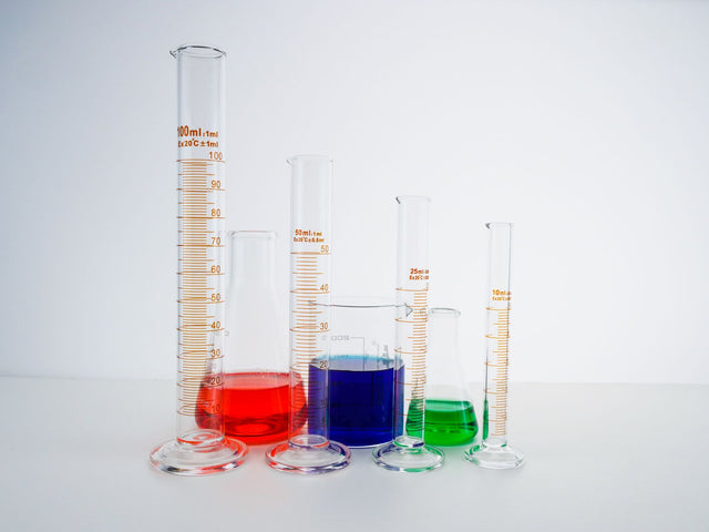 Vibrant laboratory glassware filled with colorful liquids for scientific experiments.