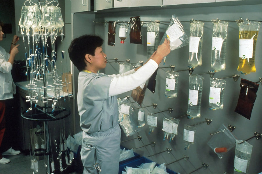 Scientist pouring liquid in laboratory — chemical testing and analysis