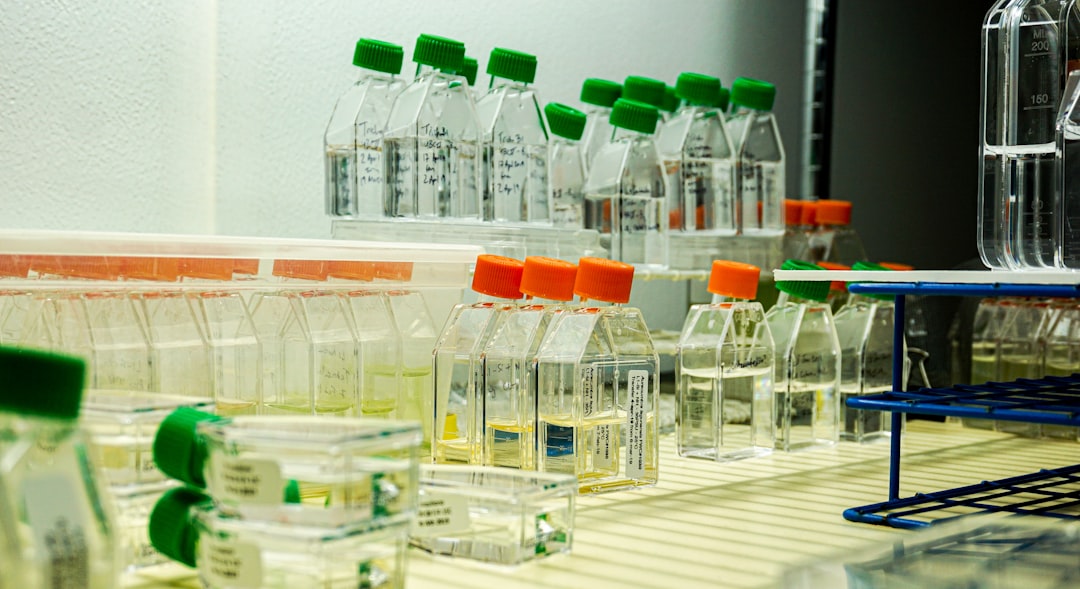 Bottles of chemical samples on a laboratory shelf