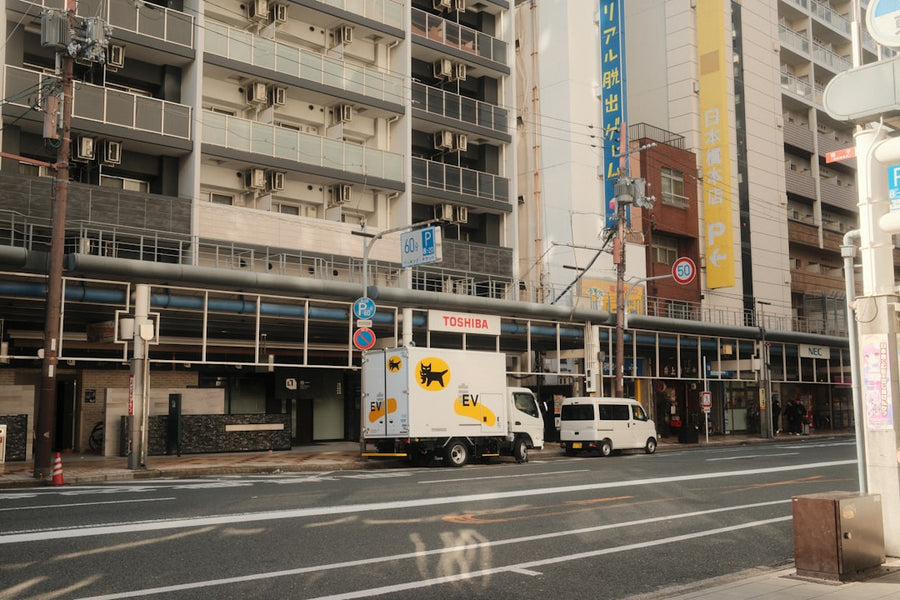 Electric truck on city street — transportation logistics