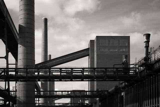 Industrial complex with tall chimneys and bridges
