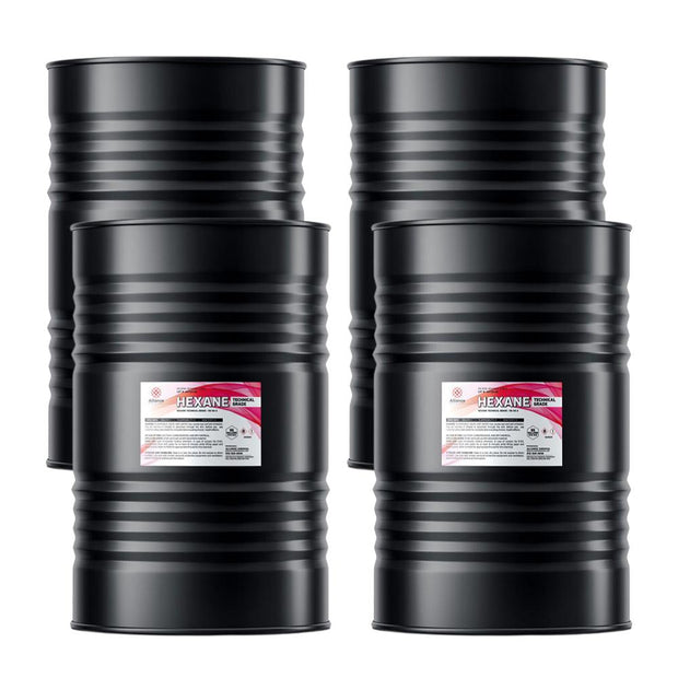 Four 55-gallon steel drums of Alliance Chemical Hexane Technical Grade with ribbed exteriors and product labels.