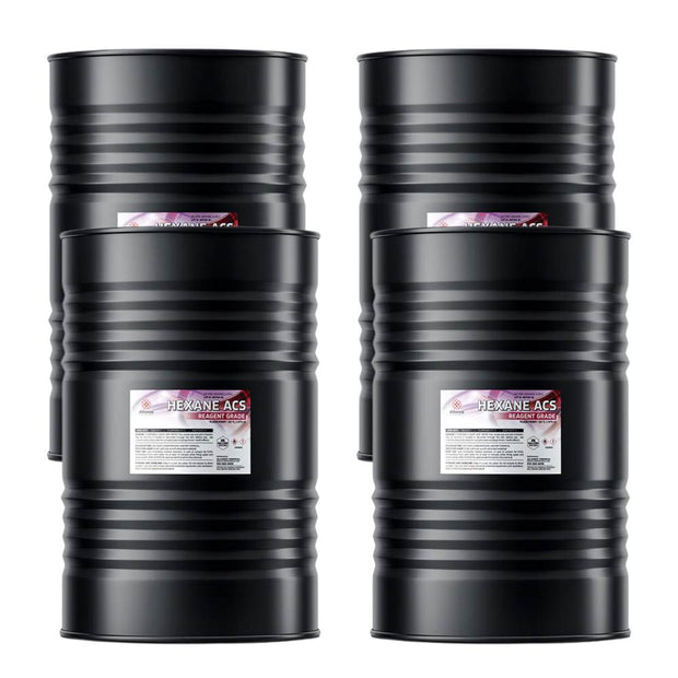 Four steel 55-gallon drums of Alliance Chemical Hexane ACS Reagent Grade with labels and ribbed exteriors.