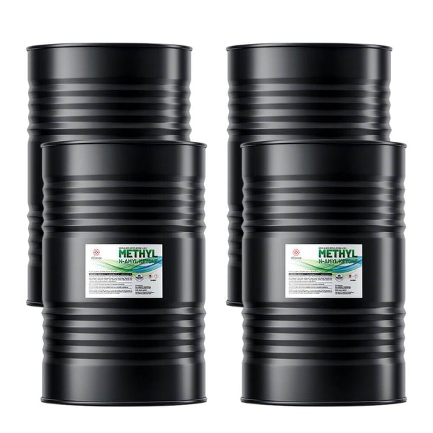 Four 55-gallon steel drums of Alliance Chemical Methyl n-Amyl Ketone (MNAK) with labels and ribbed exteriors