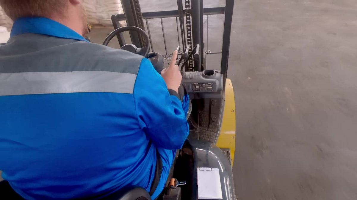 Forklift moving pallets in a warehouse
