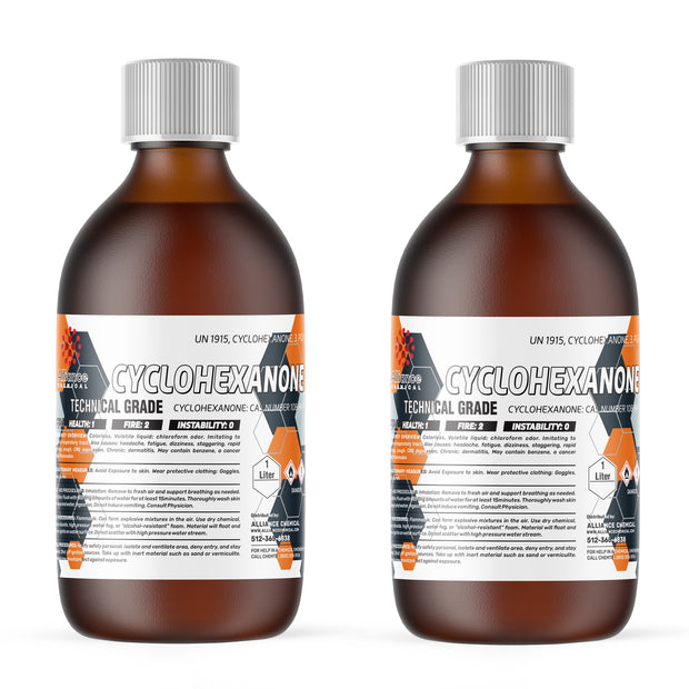 Two 1-liter bottles of Alliance Chemical Cyclohexanone Technical Grade with silver caps and safety label.